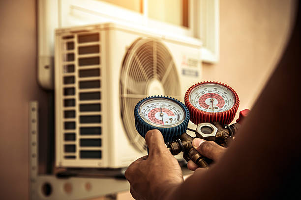 Professional Heat Pump Repair technician working in Moravia, NY